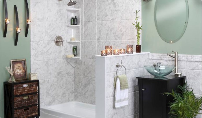 Modern bathroom featuring a walk-in shower with marble-look wall panels, a glass vessel sink, and elegant decor—showcasing a serene, spa-inspired design perfect for stylish everyday living.