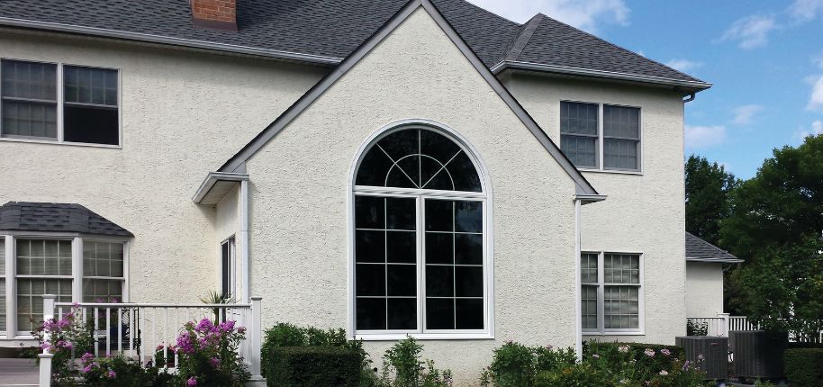 Beautiful stucco home showcasing Great Day Improvements’ quality home renovation craftsmanship in Atascosa, Texas.