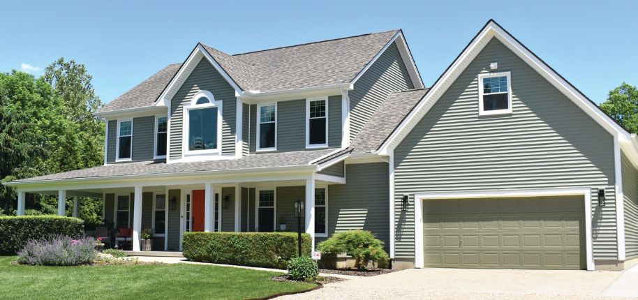 Spacious green siding home featuring Great Day Improvements’ expert exterior remodeling services in Gretna, Nebraska.
