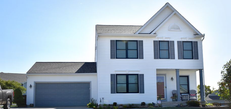 Beautiful brick home highlighting Great Day Improvements’ skilled home remodeling services available in Highland, focused on elegance and durability.