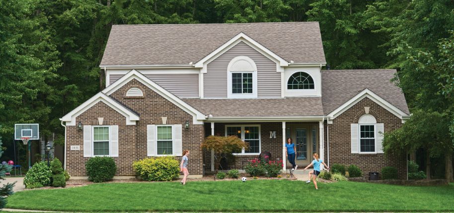 Classic suburban home with manicured lawn, reflecting Great Day Improvements’ top-tier remodeling services in Minden, Iowa.
