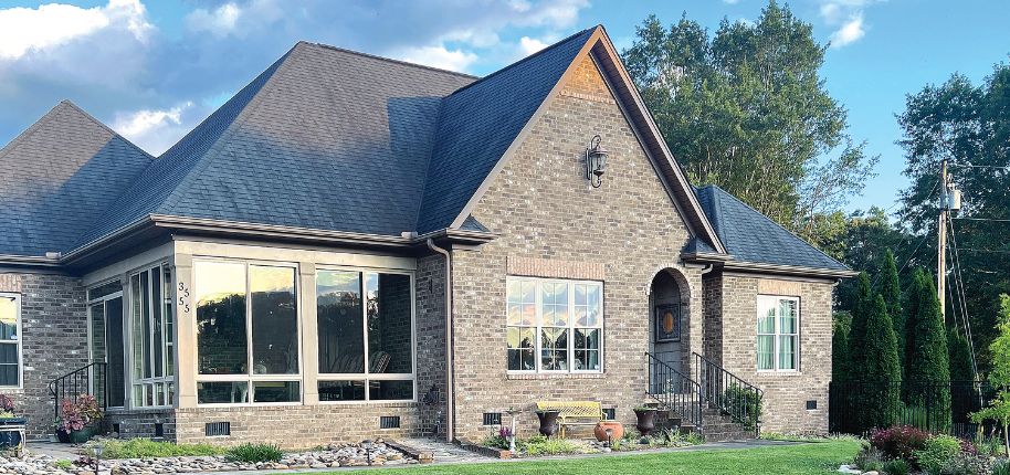 Charming brick home highlighting Great Day Improvements’ dedication to quality home remodeling across the Ridgeway area with elegant finishes.