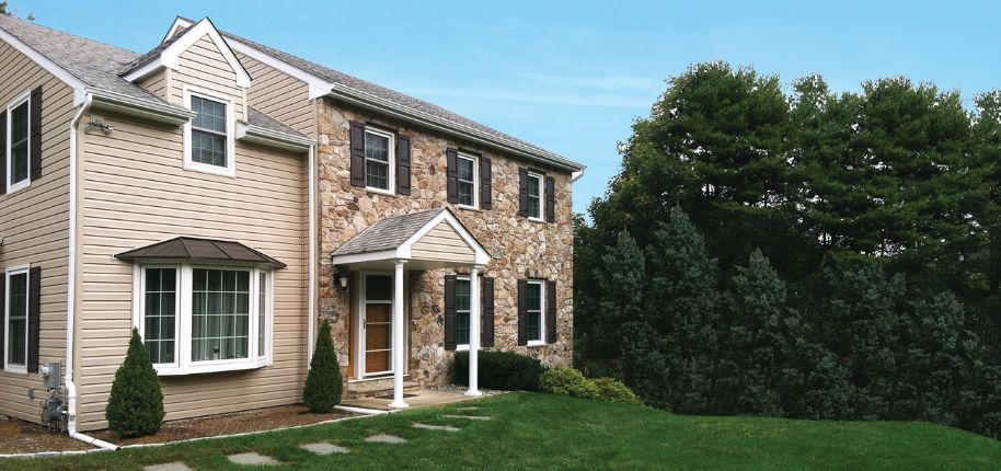 Beautiful two-story stone and siding home showcasing Great Day Improvements’ expert home remodeling services in Smyrna, Georgia, built for long-term durability and style.