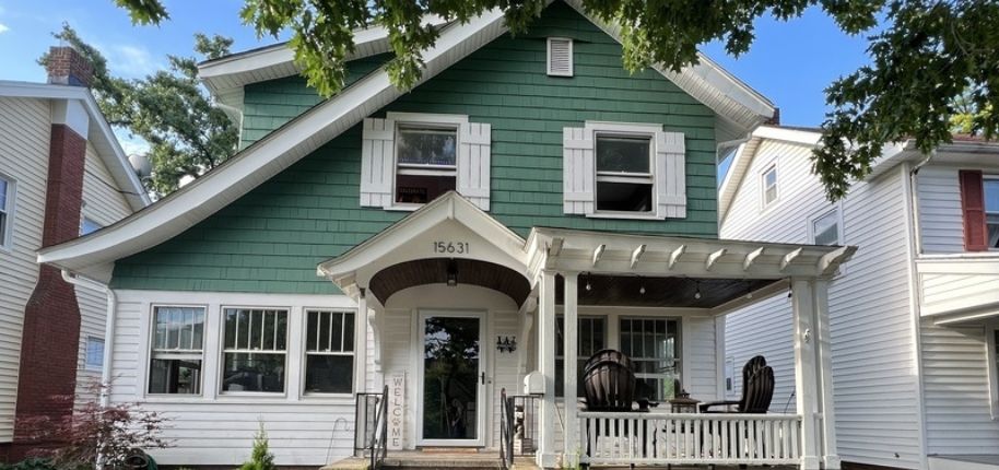 Classic green and white two-story home with a welcoming front porch, showcasing Great Day Improvements’ expert exterior remodeling in Terrell, North Carolina.