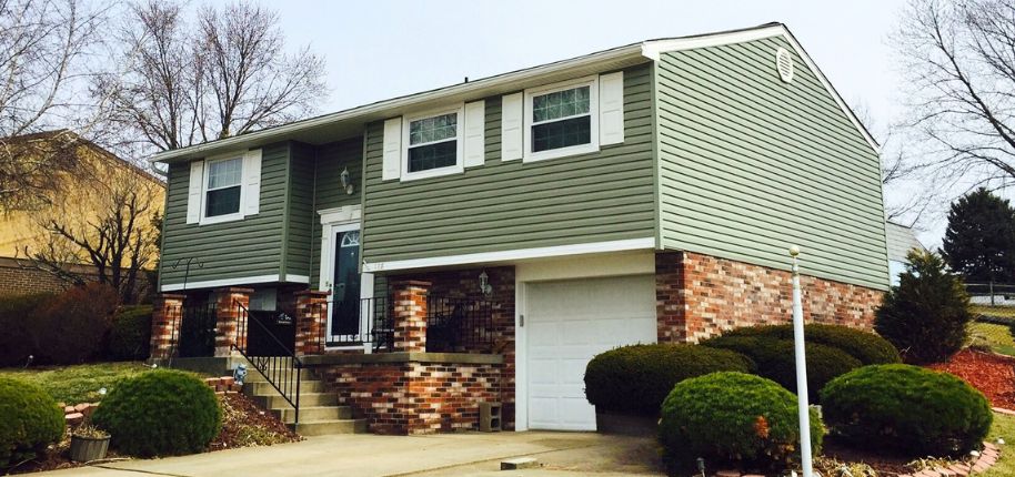 Beautifully remodeled split-level house in Waukesha by Great Day Improvements showcasing a refreshed exterior and improved entryway.
