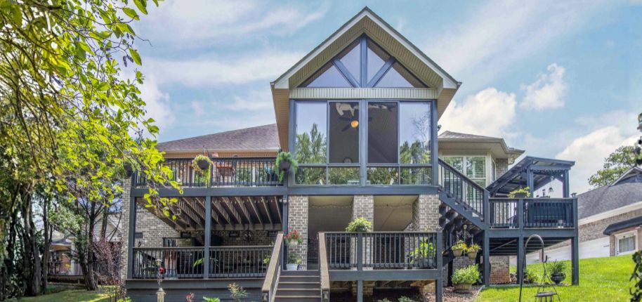 Elegant gray home with expansive glass windows and modern architecture, showcasing Great Day Improvements’ home renovation services in Westminster, Colorado.