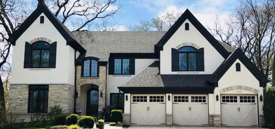 Exterior home improvement project by Great Day Improvements showcasing new windows, siding details, and a refined, classic architectural style.
