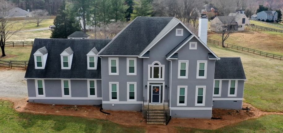 Whole-home exterior upgrade by Great Day Improvements with new siding, windows, and trim designed for energy efficiency and modern curb appeal.