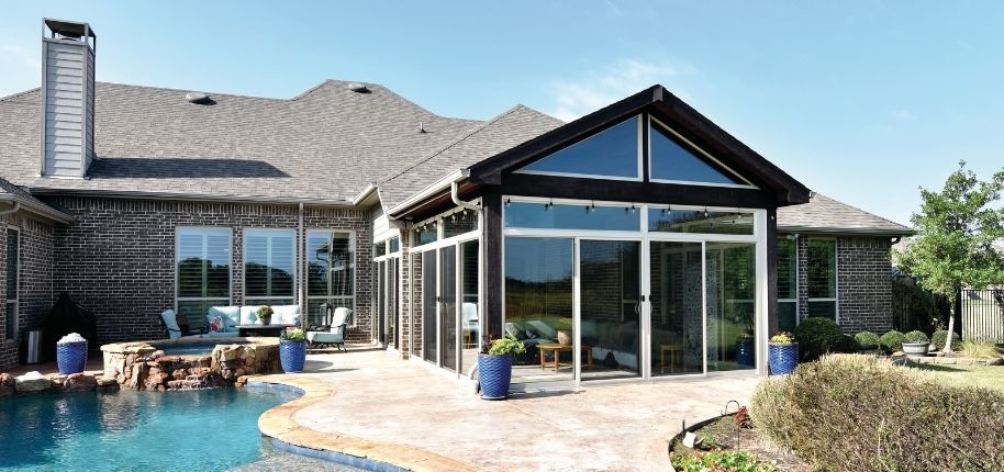 Custom home renovation by Great Day Improvements highlighting symmetrical design, updated windows, and a polished exterior finish.