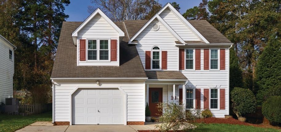 Whole-home exterior renovation by Great Day Improvements showcasing updated windows and refined brick architecture.