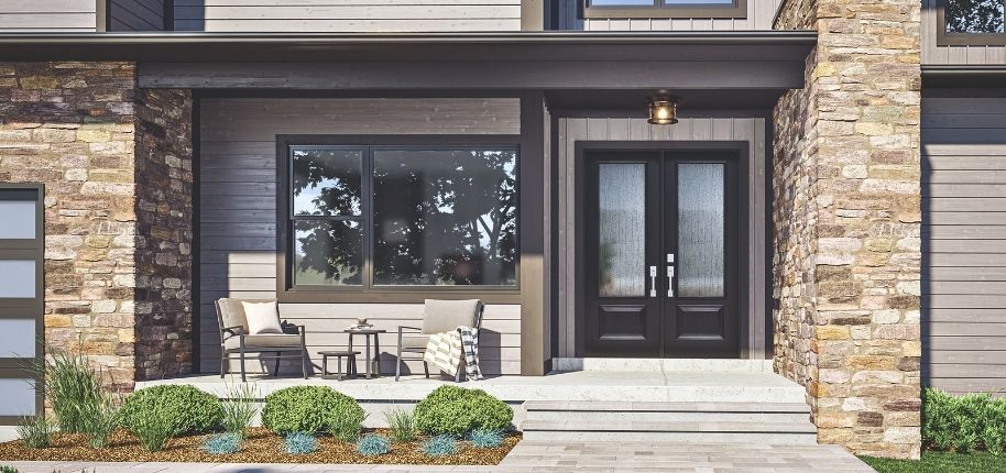 Modern home entry with stone columns, covered porch, and double front doors, remodeled by Great Day Improvements to elevate curb appeal and create a welcoming first impression.