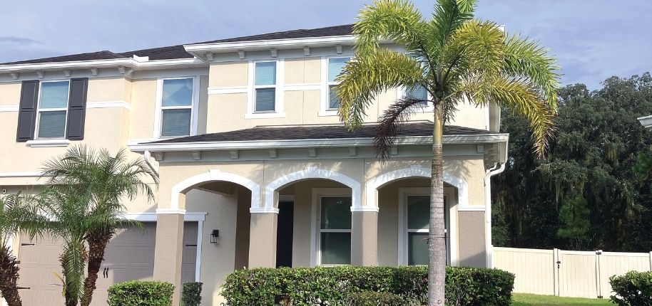 Two-story home with updated exterior finishes, replacement windows, and refreshed curb appeal, remodeled by Great Day Improvements to improve performance, comfort, and style.