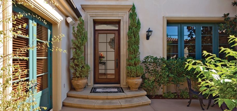Elegant courtyard-style entry with updated front door, windows, and exterior finishes, remodeled by Great Day Improvements to create a refined and inviting entrance.