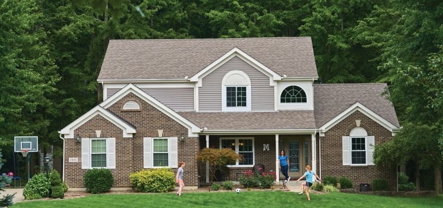 Family home with updated windows, siding, and exterior details, remodeled by Great Day Improvements to support everyday living and long-term value.