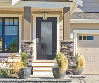 Great Day Improvements completed this front door installation with a black textured glass design that complements the Craftsman-style exterior.