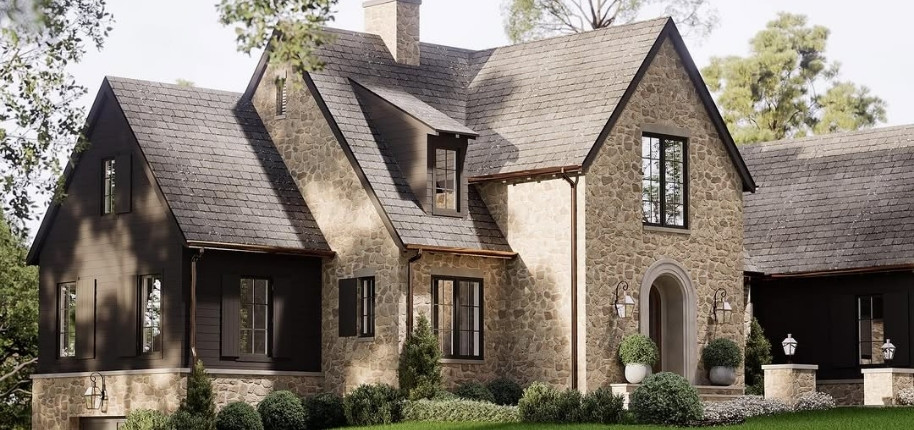 Stone cottage-style home with upgraded roofing and exterior accents, renovated by Great Day Improvements to blend timeless design with modern performance.