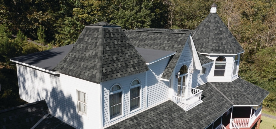 Victorian-style home with upgraded architectural shingle roof and detailed exterior trim, renovated by Great Day Improvements for lasting durability and weather protection.