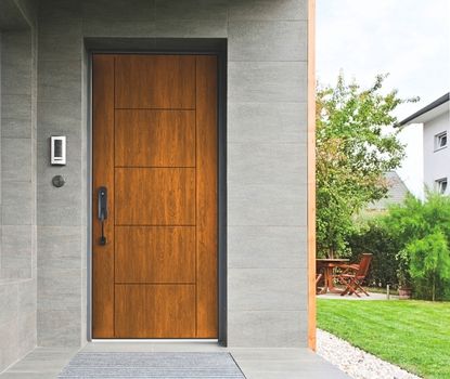 This modern wood-paneled door was selected and installed by Great Day Improvements for a high-performance door replacement.