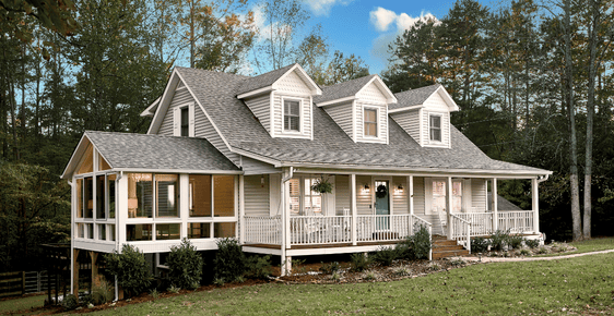 Exterior shot of a sunroom addition home renovation by Champion Windows & Exteriors.