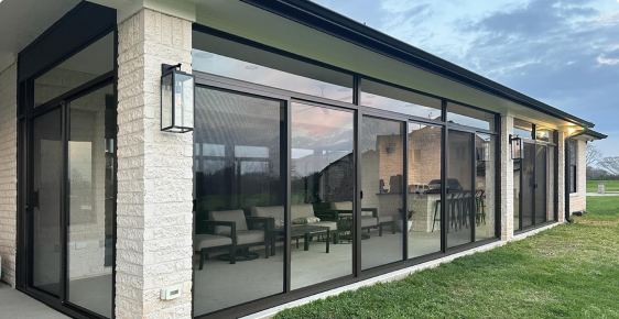 A wide-angle shot of an enclosed patio completed by Patio Enclosures.