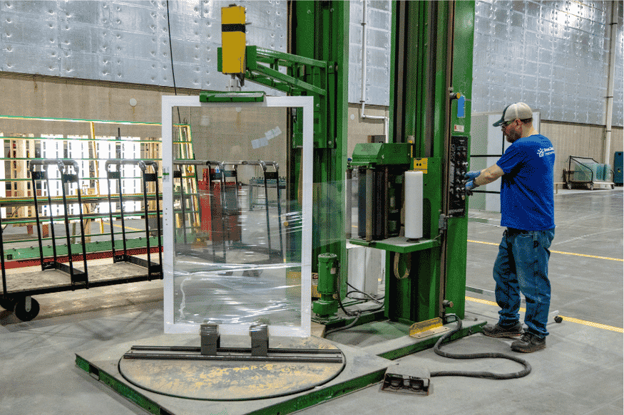 A worker prepares a patio door for shipment out of Great Day Improvement's manufacturing facility in Walton Hills, OH.