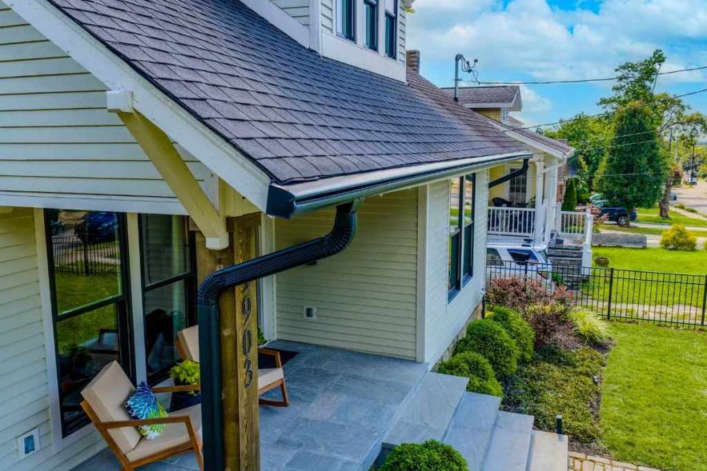 An elevated view of Leafguard gutters on the front of a house.